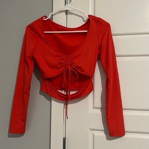 Coral long sleeve crop top with cutout